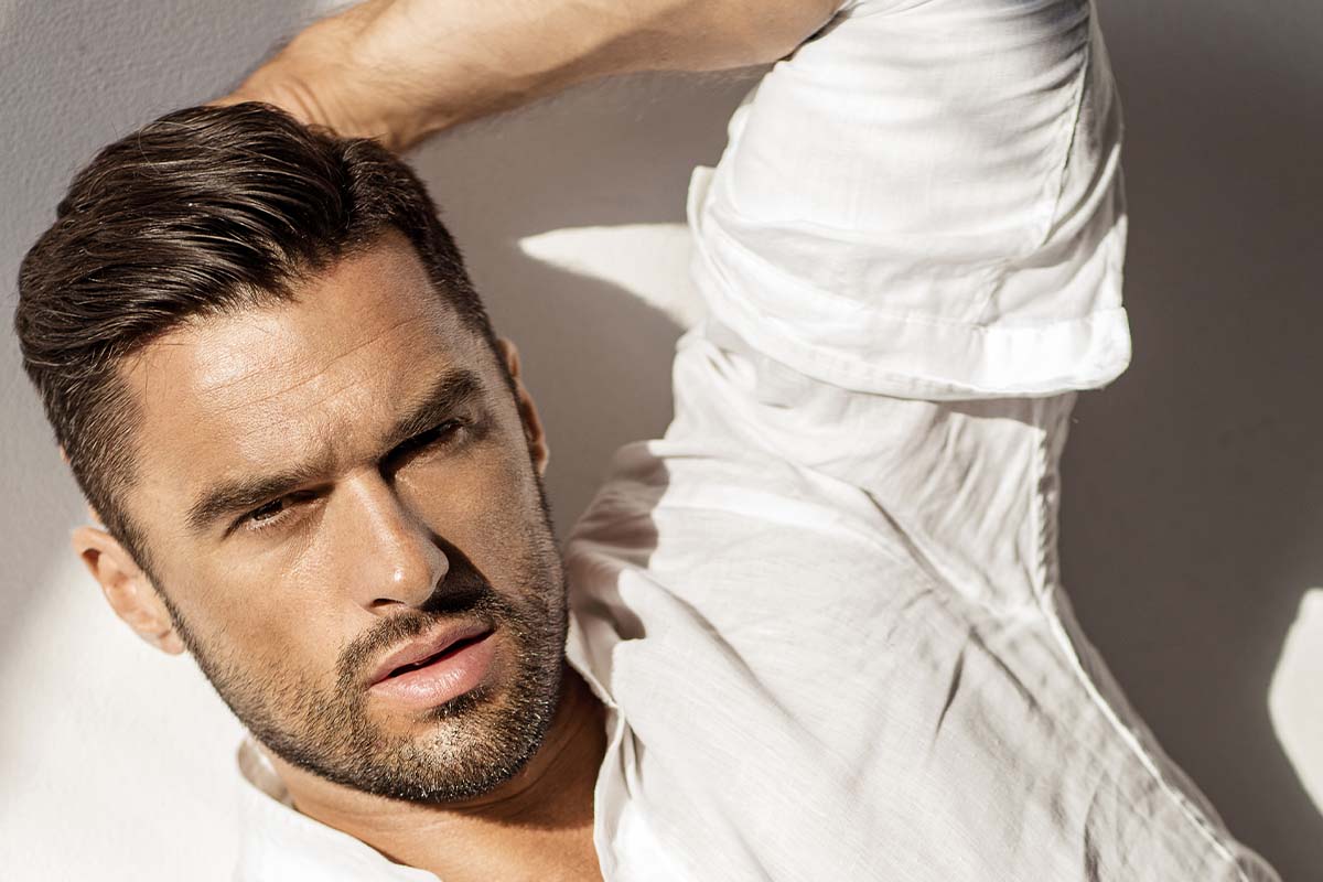 A man with full hair after hair restoration in Atlanta.