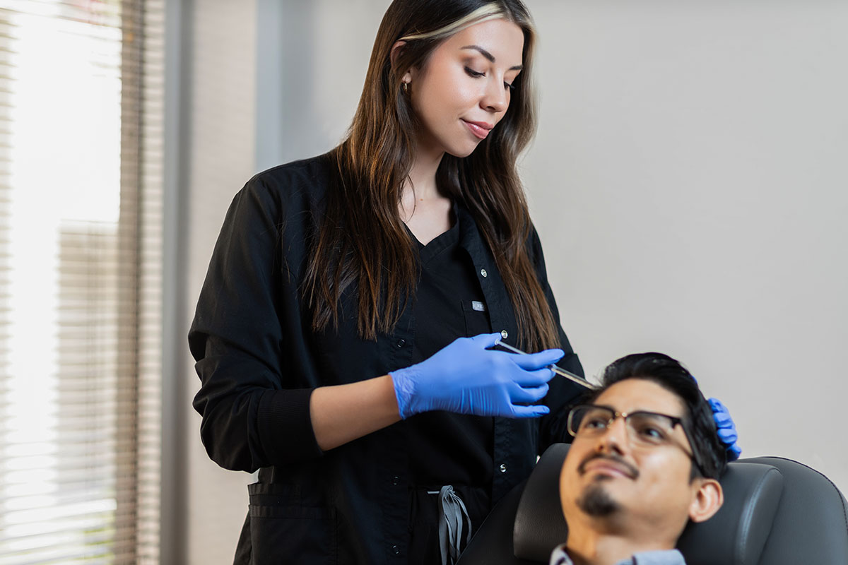 A man getting male hair transplant in Atlanta.