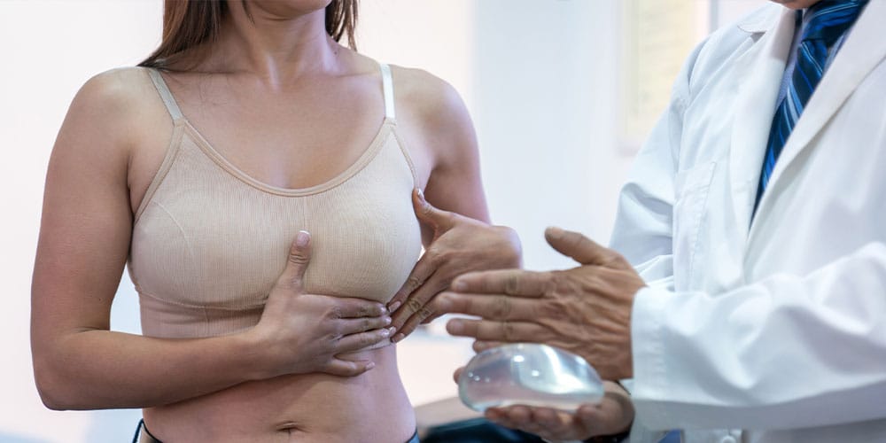 woman consulting with her doctor in Atlanta about breast implant sizes